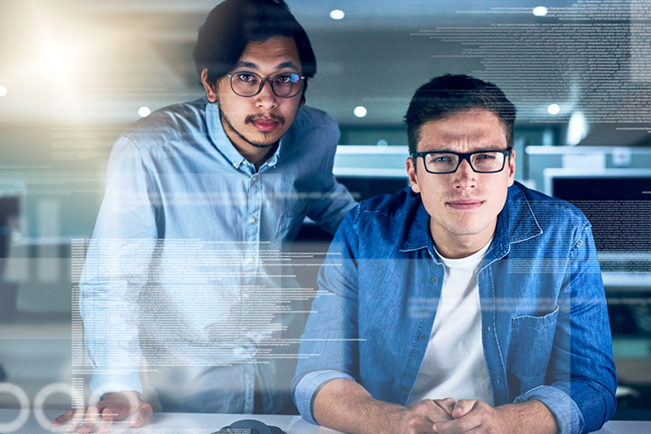 Integration Flexibility and APIs Two men looking at a data screen